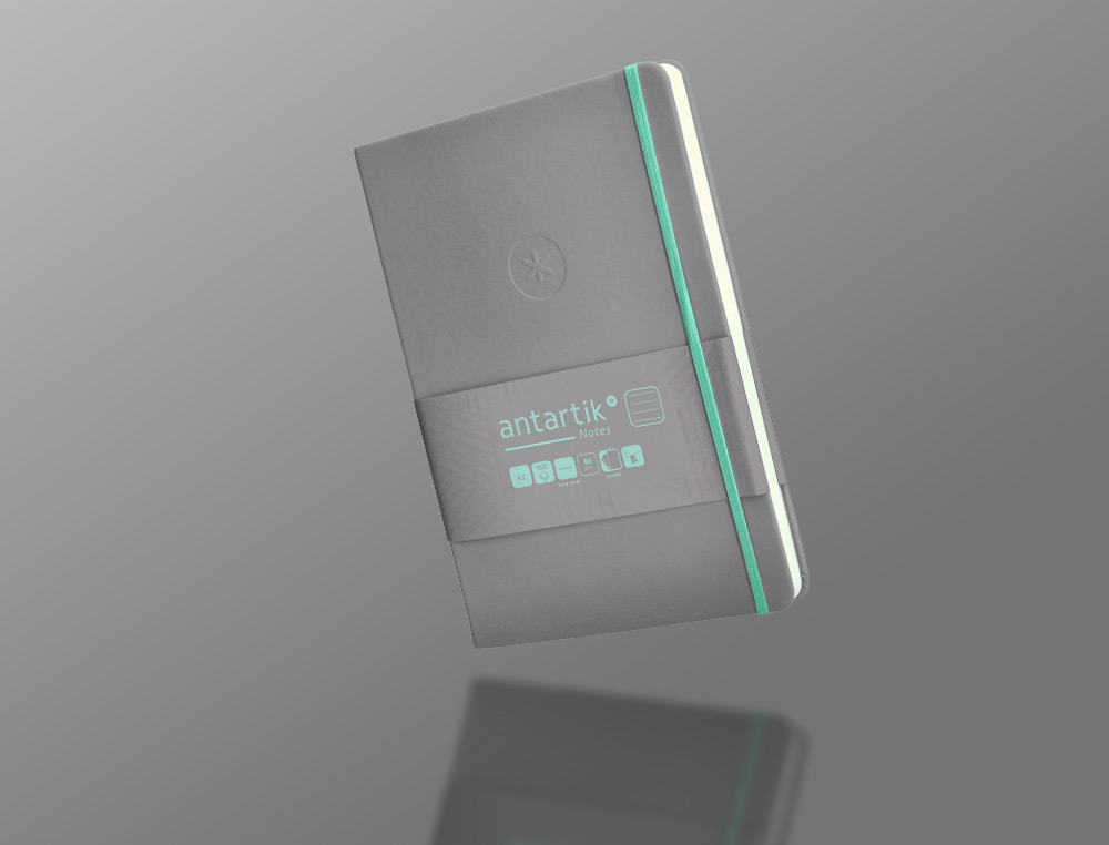 CADERNO COM ELASTICO ANTARTIK NOTES CAPA DURA A5 PAUTADO CINZA E TURQUESA 100 FOLHAS 80 GR FSC