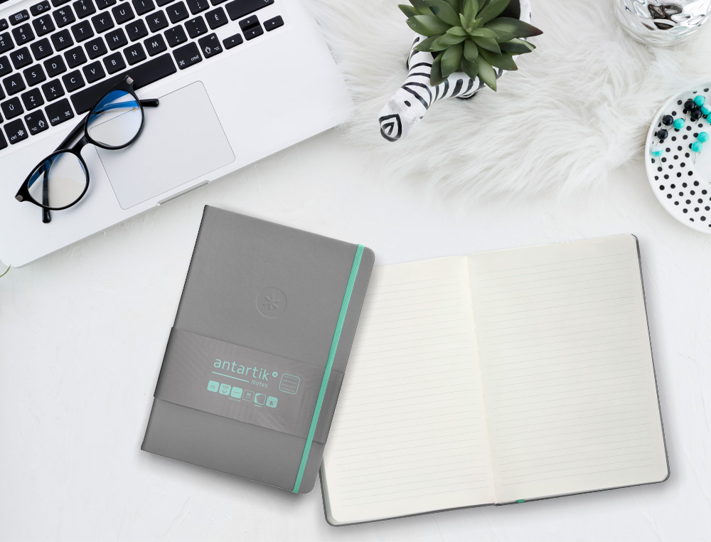 CADERNO COM ELASTICO ANTARTIK NOTES CAPA DURA A5 PAUTADO CINZA E TURQUESA 100 FOLHAS 80 GR FSC