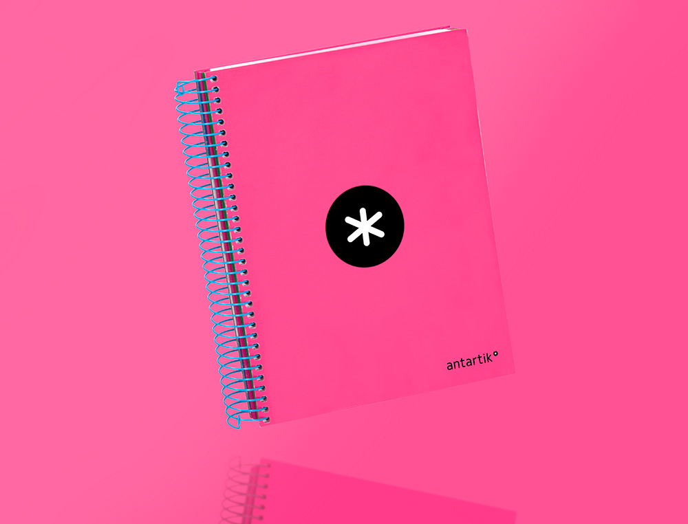 CADERNO ESPIRAL DIN A5 ANTARTIK CAPA FORRADA 120 F 100 GR LISO COM BANDAS DE CORES 6 FUROS COR ROSA FLUOR
